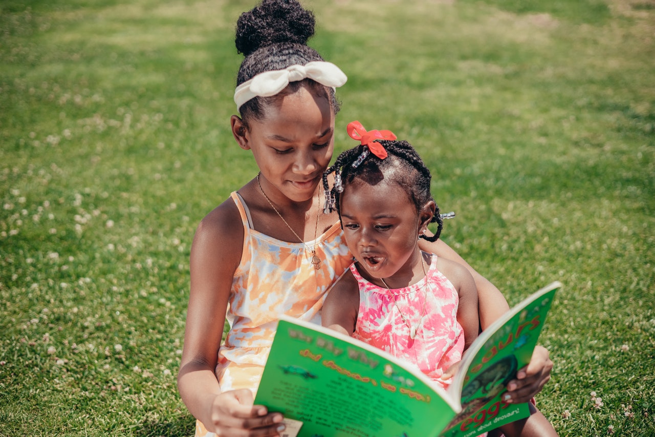 black girl reading a book